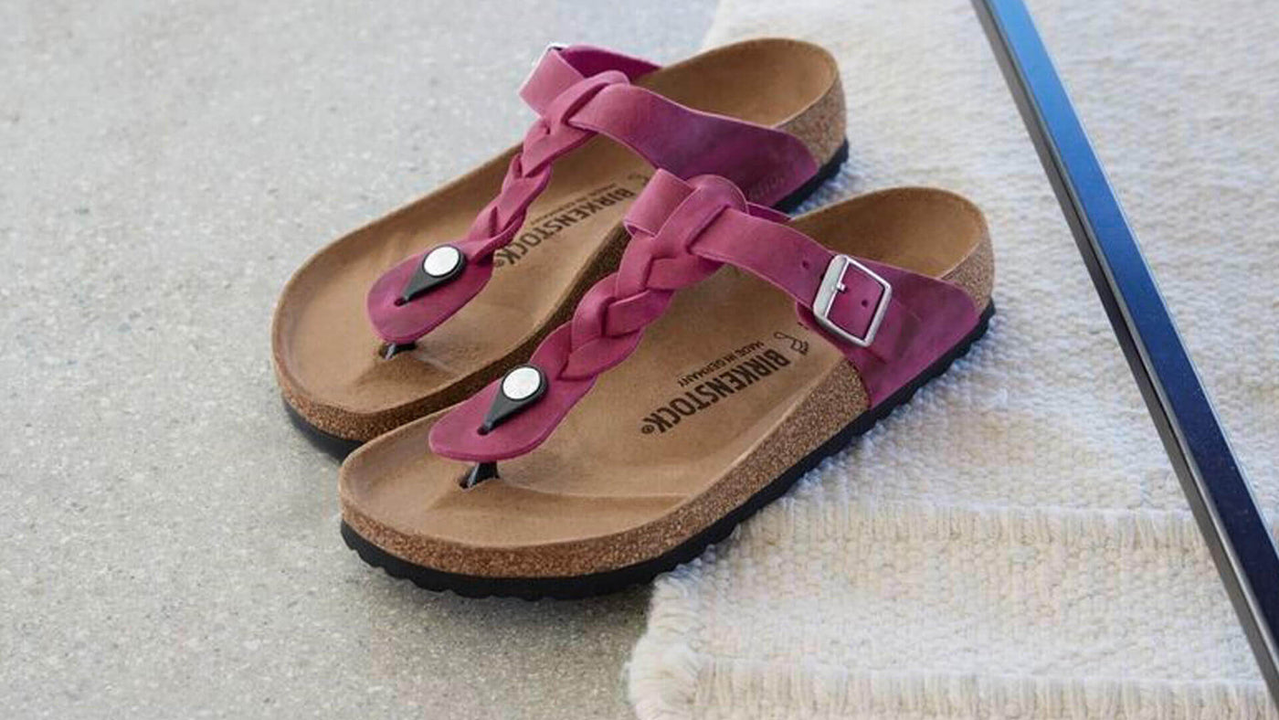 Birkenstock pink Giza sandal on throw rug
